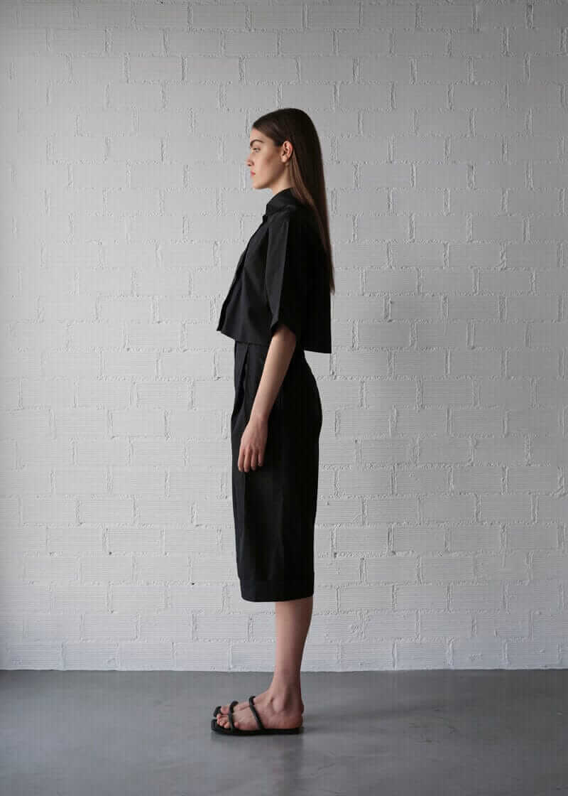 black bermuda shorts side with boxy short sleeve shirt